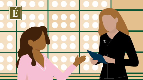 woman at a spa talking to an esthetician